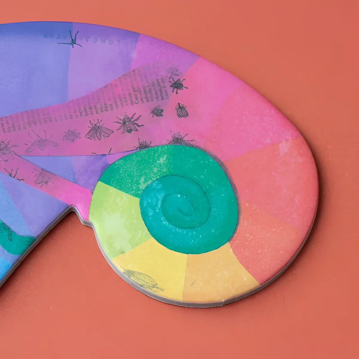 Bunte Papierschablone Chameleon Big Eye mit grüner Spirale und Farbfeldern
