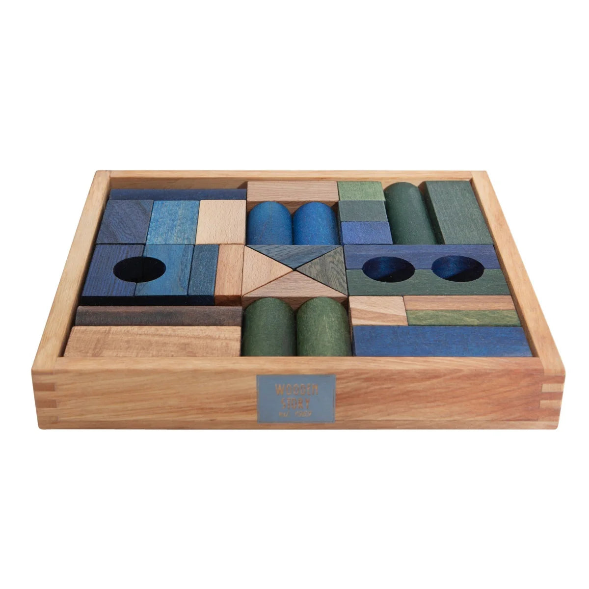 Wooden cold blocks set in light oak tray with blue and green geometric pieces for nachhaltige babykleidung schweiz