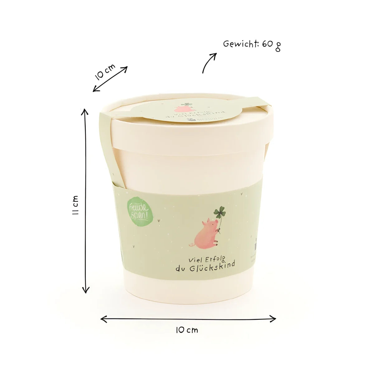Glückskind becher aus cremefarbenem papier mit grünem band und pinkem glücksschwein für ökologische baby- & kinderprodukte
