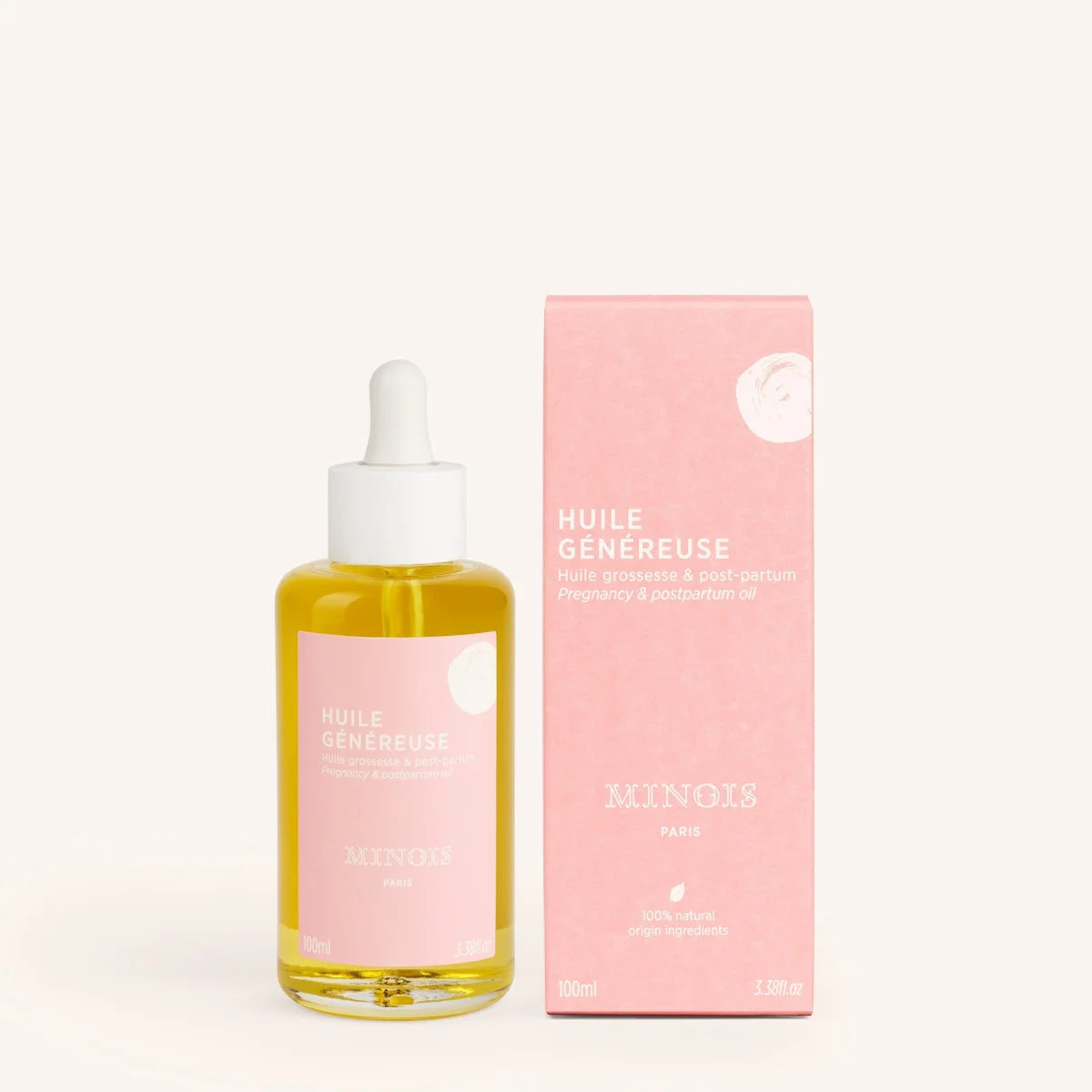 Rosa etikettierte glasflasche minois paris mamaöl 100 ml mit weißem tropfverschluss und goldgelbem inhalt
