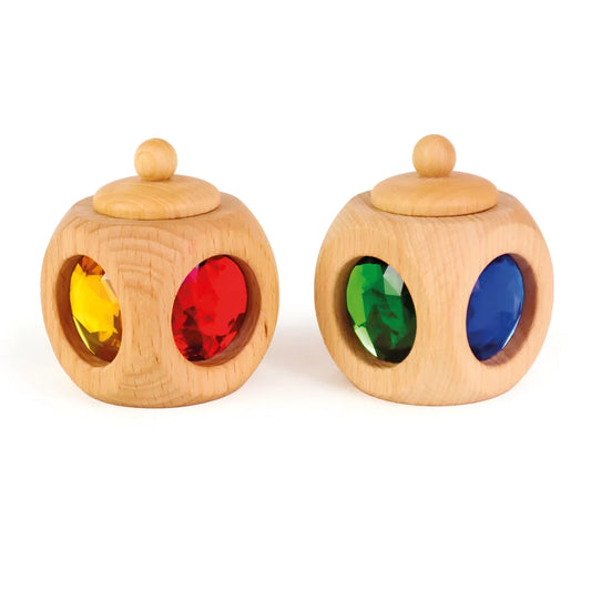 Holzball mit bunten Edelsteinen in der Tooth Box