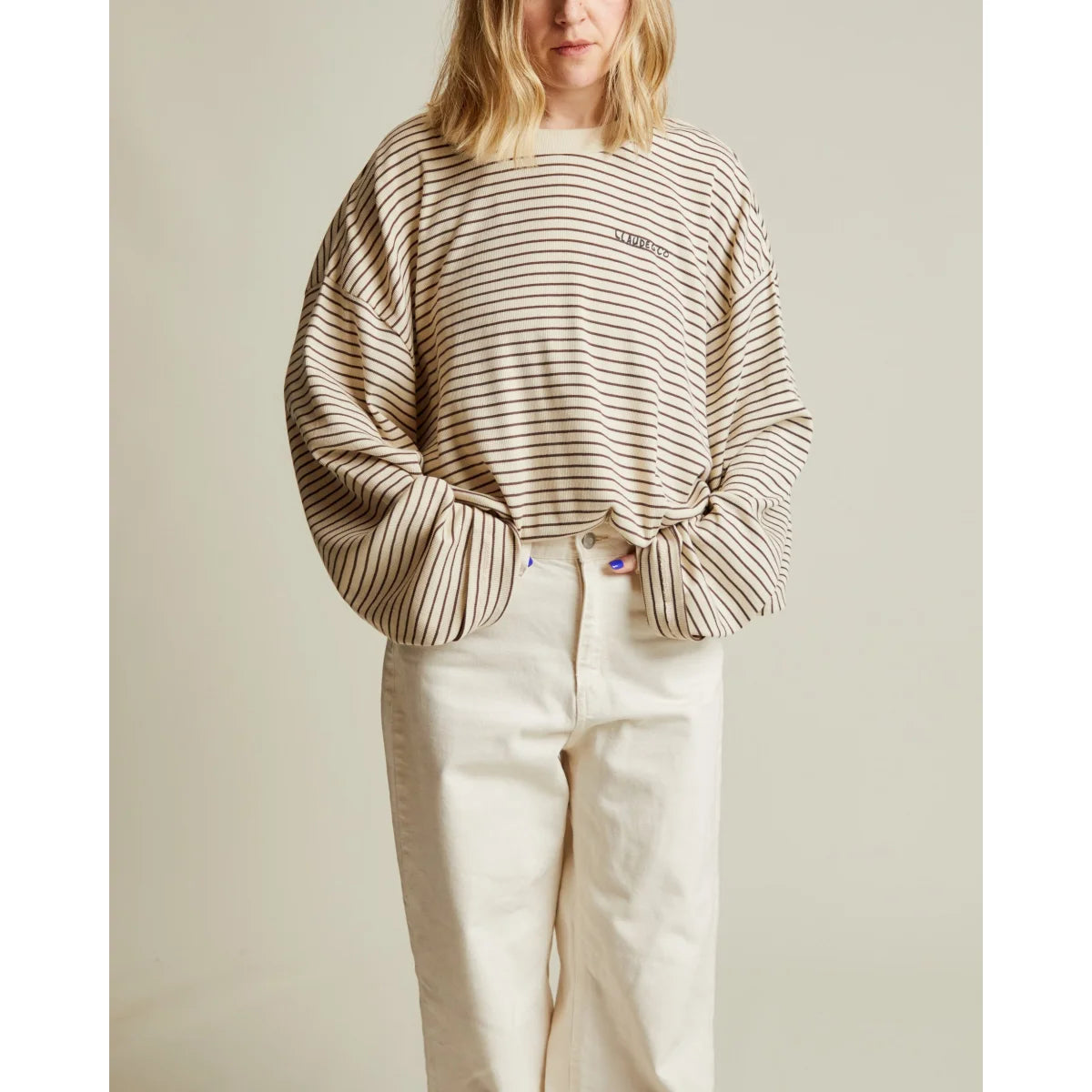 Off-White und schwarz gestreiftes Langarmshirt Lenni Coco mit kleinem Logo auf der Brust