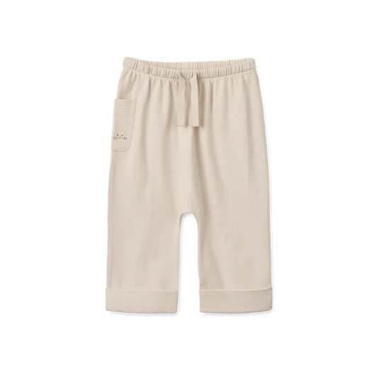 Beige Jogginghose mit Kordelzug und hochgekrempelten Säumen von Babyhose Alain | Sandy