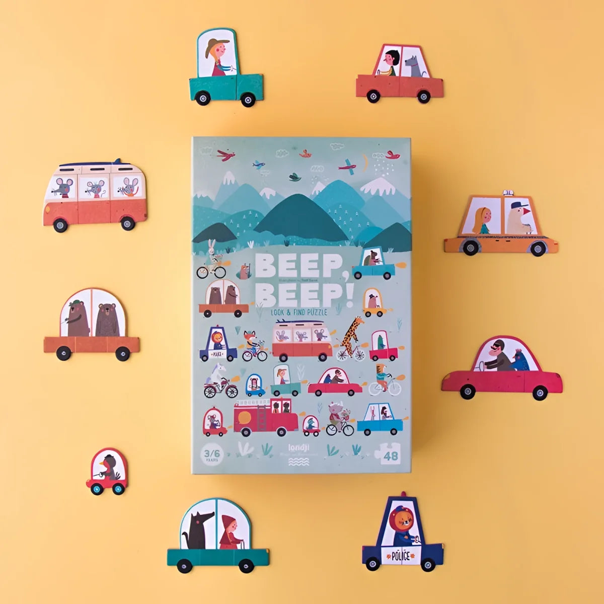 Buchcover mit lustigen Fahrzeugen und Bergen für Beep, Beep! Puzzle