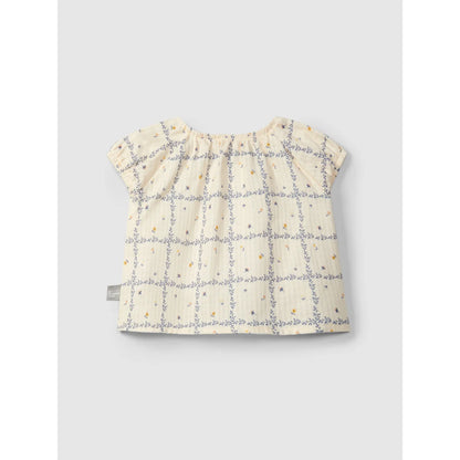 Einfache Bluse aus bedrucktem texturiertem Baumwollstoff mit Blumenmuster