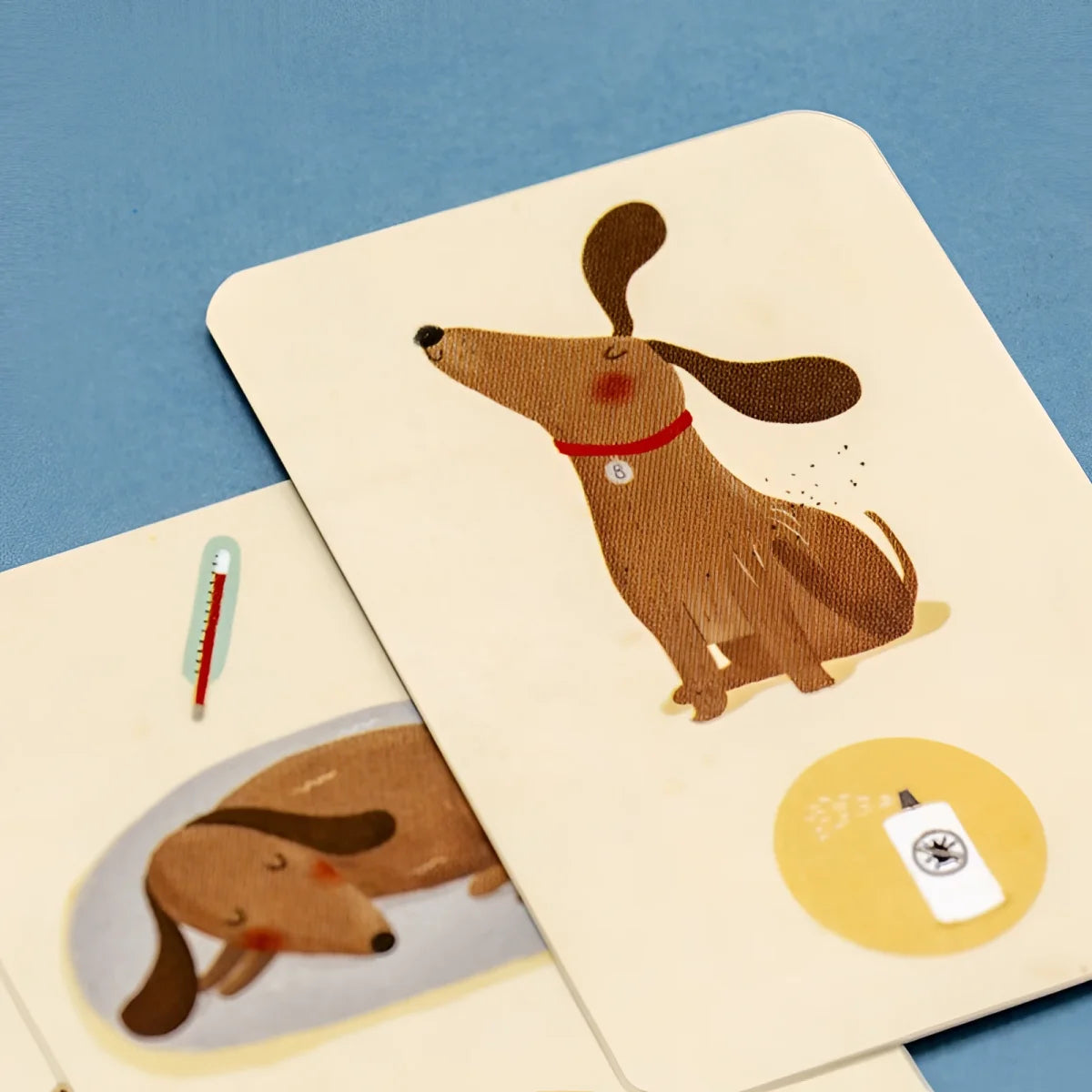 Bobby & Misha Tiny Game: Sahnekarte mit braunem Dackel und Hasengarten-Puzzle