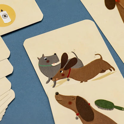 Bobby & Misha Tiny Game: Sahnekarte mit zwei Dackeln und Kaninchen-Garten-Puzzle