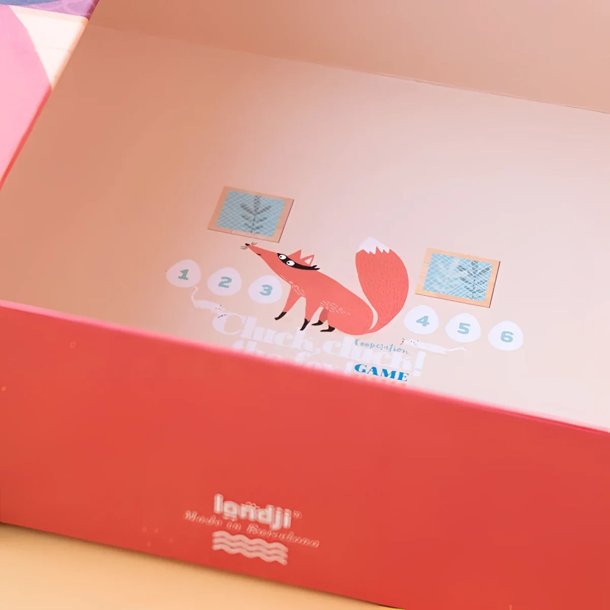 Pink fox illustration on coral surface for Cluck, cluck! The Fox! Game