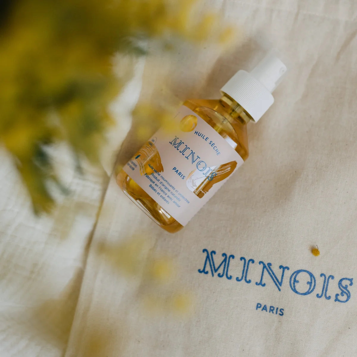 Flasche mit gelbem Trockenöl und weißen Pump für Dry Oil 150ml