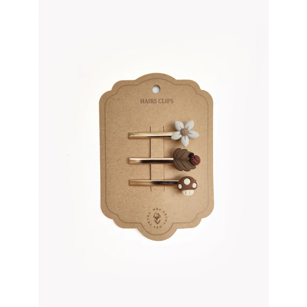 Set von drei dekorativen Haarclips auf einer Pappe-Displaykarte