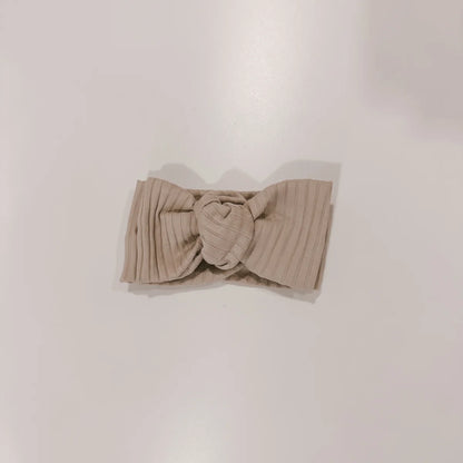 Beige gerippter Baby-Haarband mit Knoten aus der Headband Kollektion