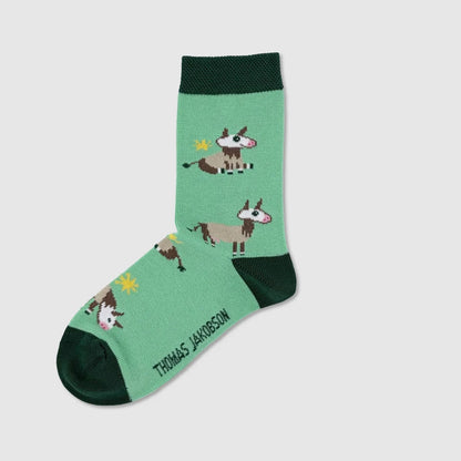 Kindersocken KÜHE von Thomas Jakobson, linke Socke mit Kuh-Motiv