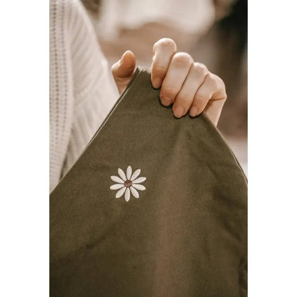 Wildride child carrier daisy embroidery at Littlies + mums