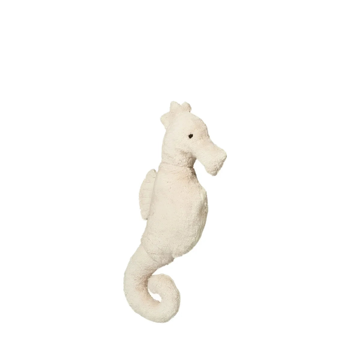 Kleines kuscheltier seepferdchen in creme mit weichem stoff und schwarzen stickaugen für ökologische babyprodukte
