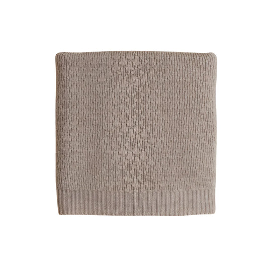 Beige gestrickte quadratische Textilie mit geripptem Rand der Merino Strickdecke Dora