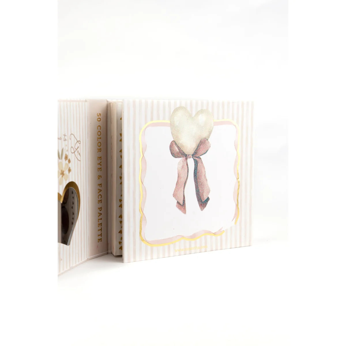Eine zarte cremefarbene eyeshadow und gesichtspalette mit rosa schleifendesign für nachhaltige babykleidung schweiz geschenke