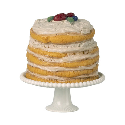 Partytorte mit Tortenständer Off White: mehrschichtige gelbe Torte mit bunten Obst-Toppings