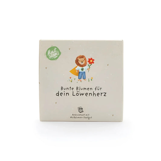 Beiges Karton-Pflanzkästchen mit Cartoon-Löwe in blauer Latzhose und roter Blume: Mutblumen