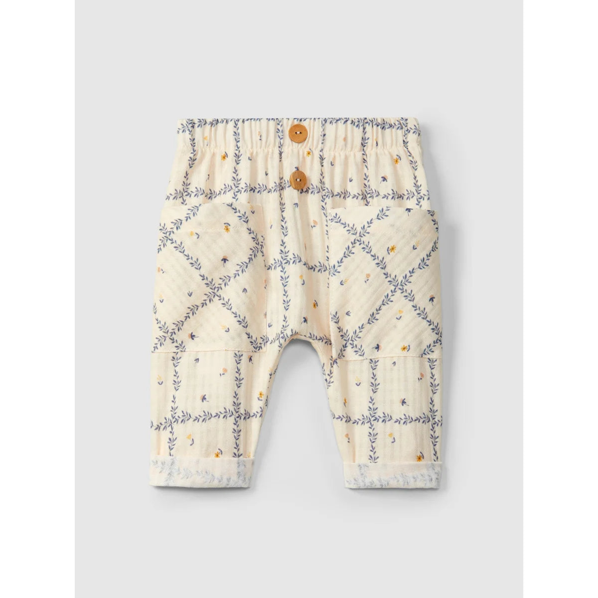 Beige Babyhose bedruckte Strukturbaumwolle mit dekorativen Holzknöpfen