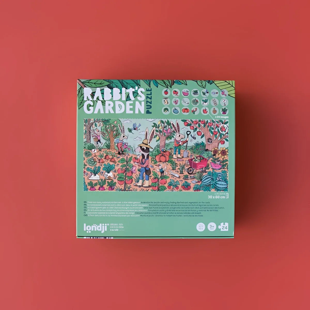 Brettspielverpackung zu Rabbit’s Garden mit bunten Kaninchen und Blumen auf grünem Hintergrund
