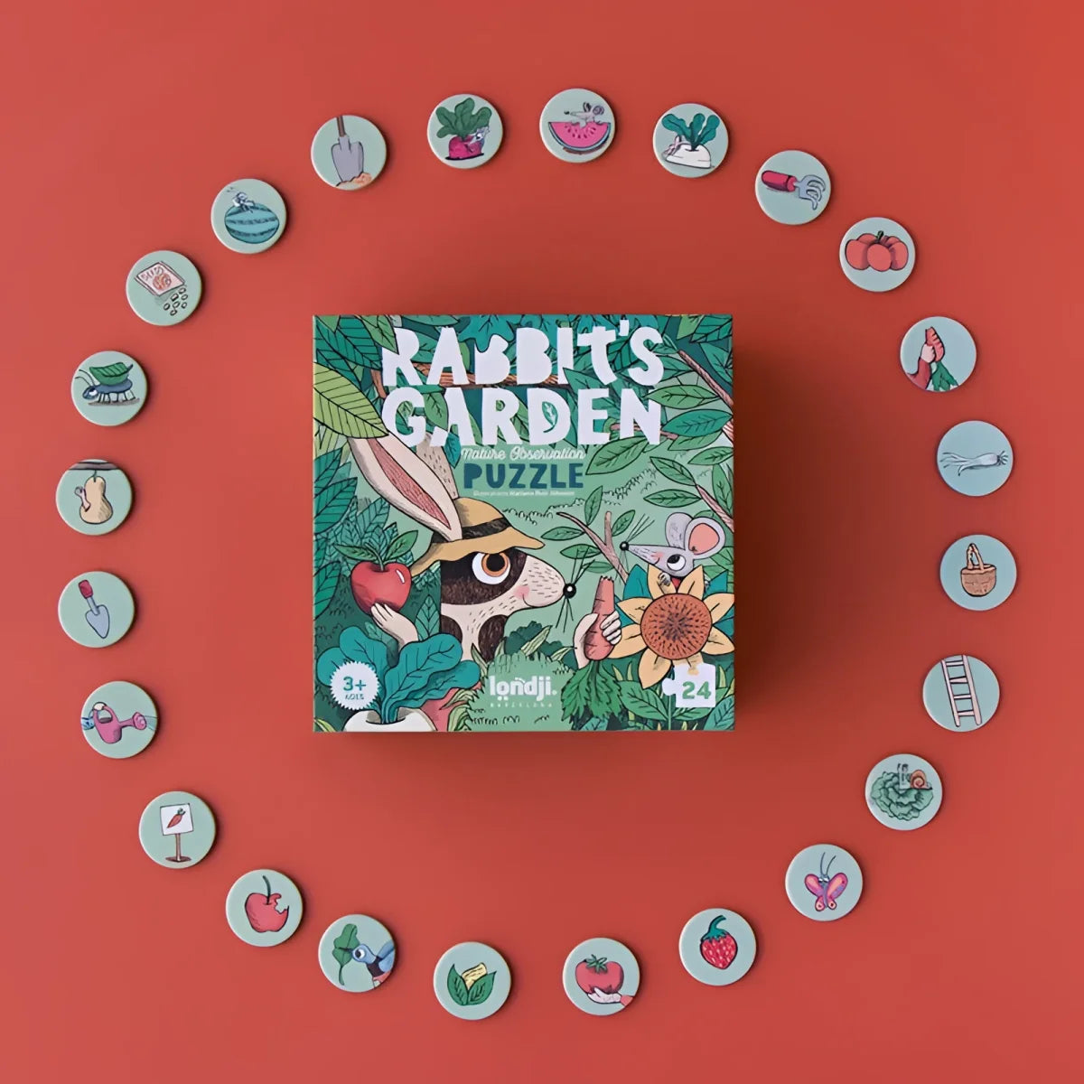 Puzzlebox Rabbit’s Garden umgeben von runden Spielsteinen in Ringform