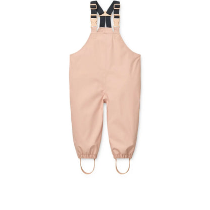 Beige wasserdichte overalls mit schwarzen verstellbaren trägern und elastischen bündchen im regenbekleidungsset manu