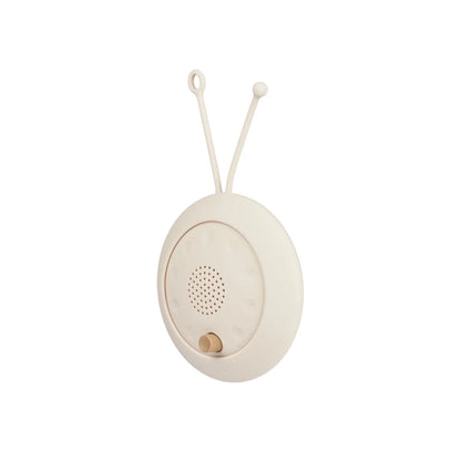 Helles cremfarbenes runder Baby-Mobile-Musikbox mit zwei oberen Schlaufen und Lautsprechergitter