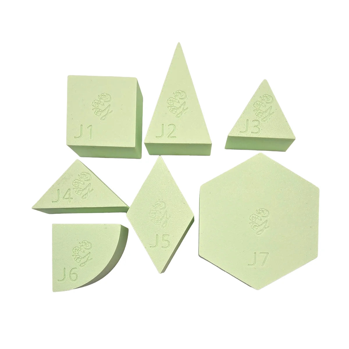 Set aus sieben hellgrünen geometrischen Schaumstoffblöcken spielschälchen Mandigo diverse formen grün