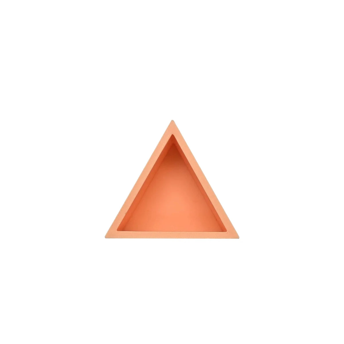 Ein mandigo spielschälchen in pfirsichfarben mit dreieckigem design und matter oberfläche aus hochwertigem material