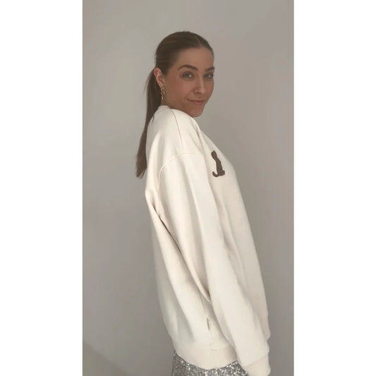 Weißes Sweatshirt mit dunkler Schrift auf der Vorderseite, Produktname Sweater women Puppy