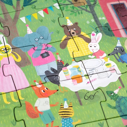 Buntes Kinderpuzzle mit cartoon-Tieren in Partyhüten beim Geburtstagspicknick