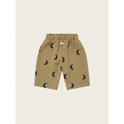 Tanshorts mit schwarzen Mondmustern für Traveller Pants Dusky Midnight
