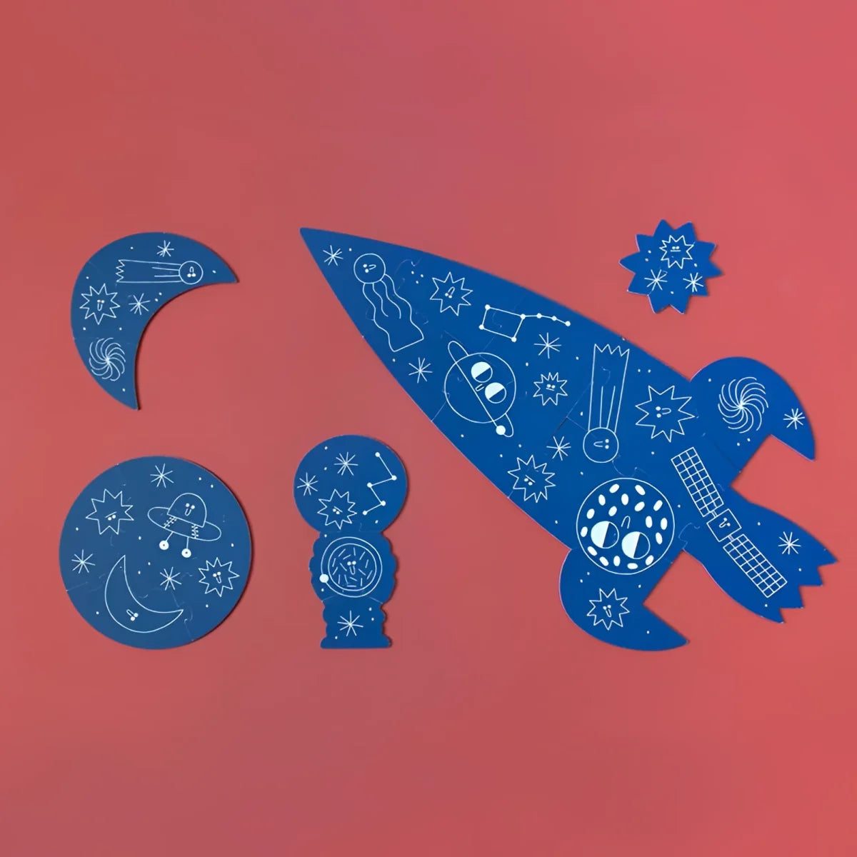 Stilisierte blaue Rakete mit himmlischen und kosmischen Symbolen im Valentina in Space Puzzle