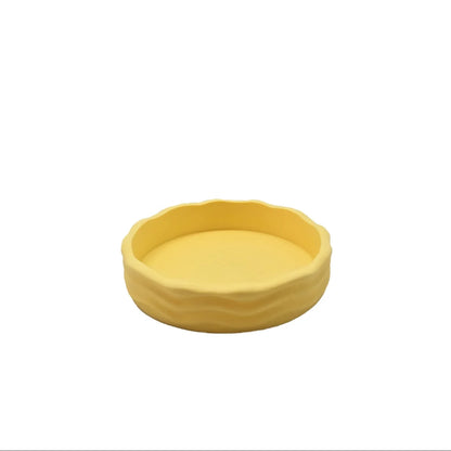 Runde gelbe Keramik-Futternapf mit welligem Rand aus dem Wave Schalen-Set Pastell